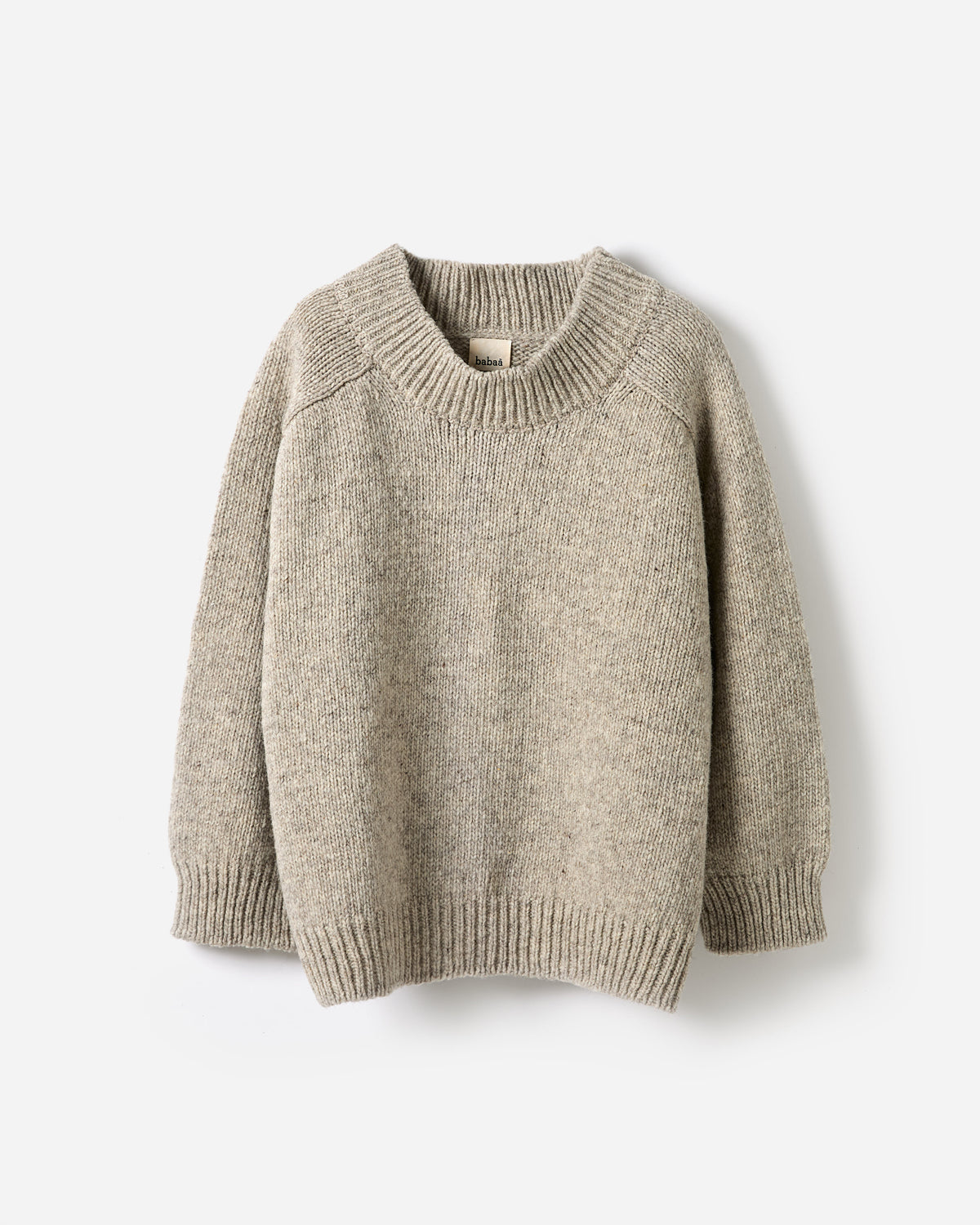 Silhouette of a woman wearing Babaà No51 Mist jumper, showcasing its relaxed fit and soft fabric in a stylish casual look.