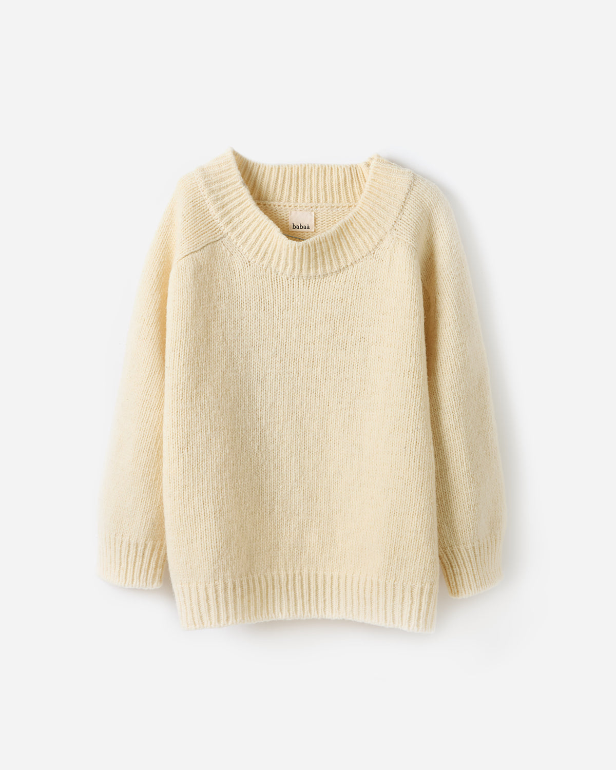 Woman wearing Babaà No51 natural jumper, showcasing the relaxed fit and soft fabric in a casual silhouette.