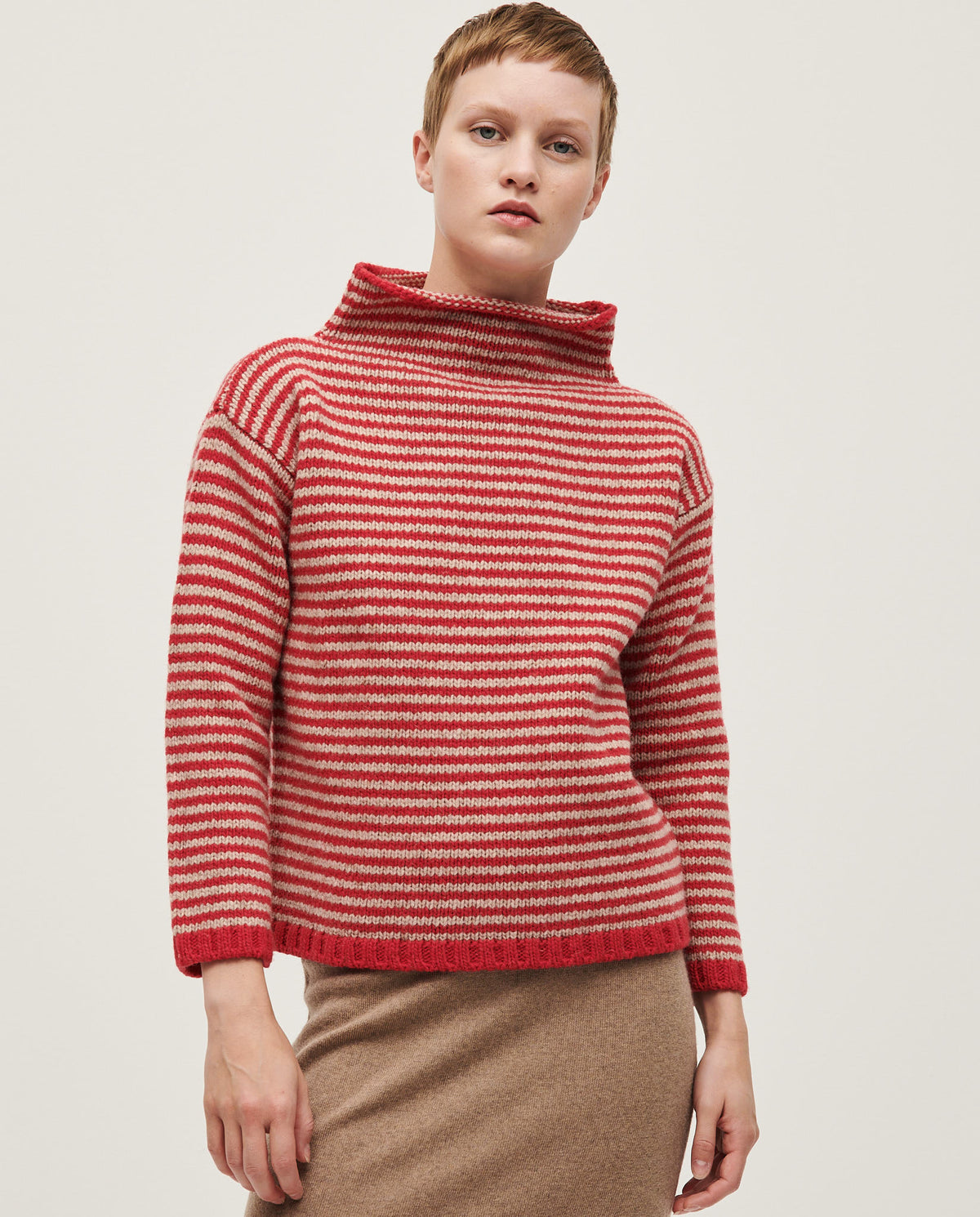 Woman wearing Babaà No6 Ruby jumper, featuring a cozy, vibrant red knit design perfect for casual and stylish looks.