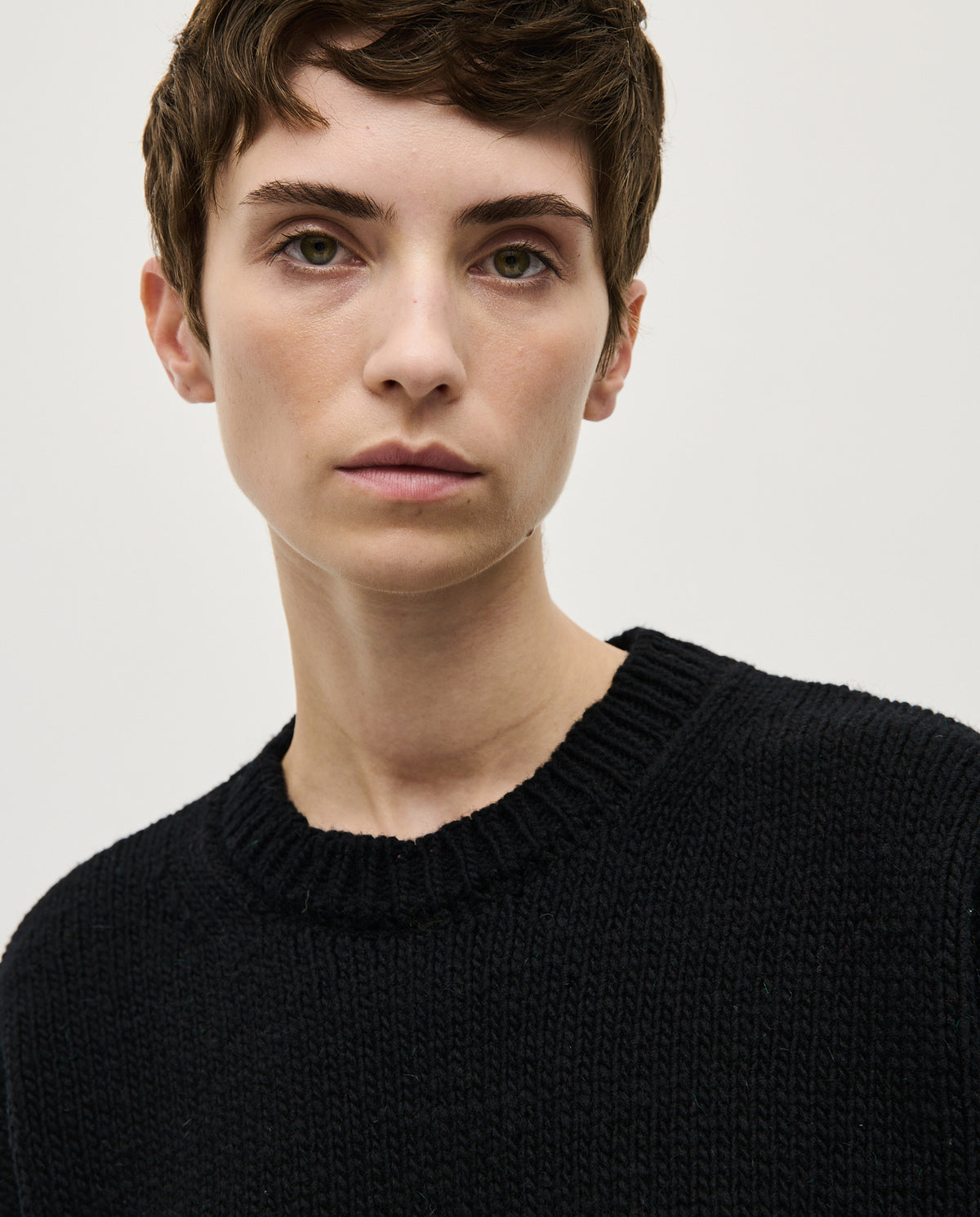Black Babaà No61 women's jumper shown on a model, featuring a cozy, stylish knit design with a relaxed fit.