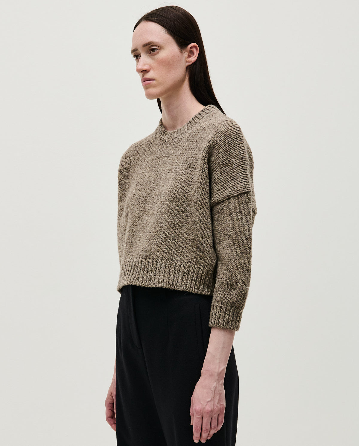 Dark mist jumper No61 by Babaà, worn by a woman, showcasing a cozy, stylish knit sweater with a relaxed fit.