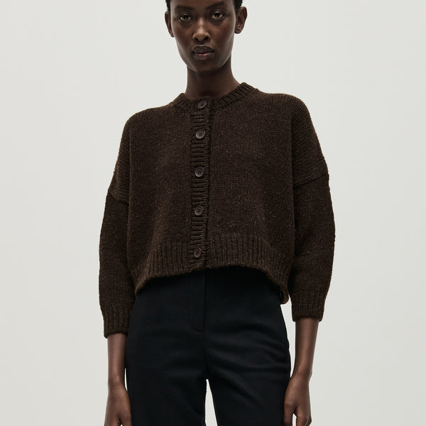 Babaà No61 Earth cardigan worn by a woman, showcasing the cozy knit sweater with earthy tones and relaxed fit.