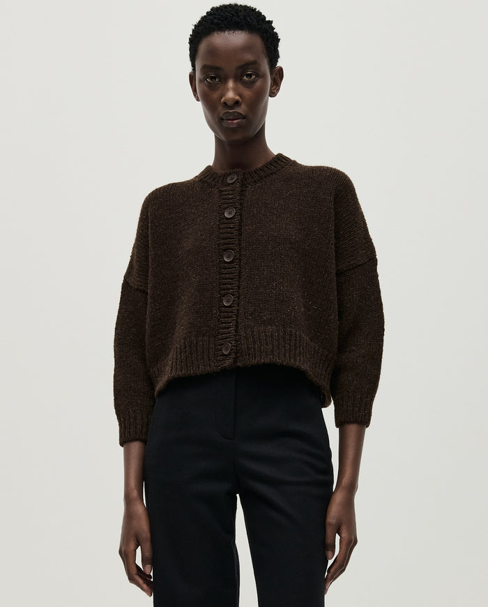 Babaà No61 Earth cardigan worn by a woman, showcasing the cozy knit sweater with earthy tones and relaxed fit.