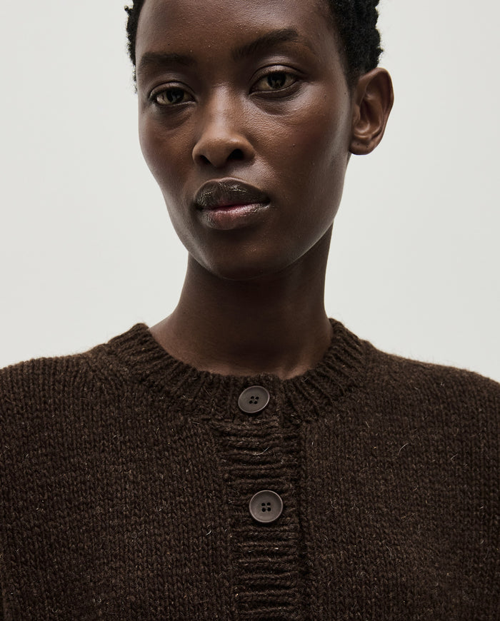 Babaà No61 Earth cardigan worn by a woman, featuring a cozy, earthy-toned knit with button details and a relaxed fit.