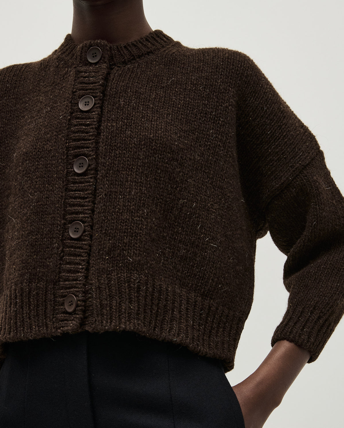 Babaà No61 Earth cardigan worn by a woman, featuring a cozy, earthy-toned knit jumper with a relaxed fit.