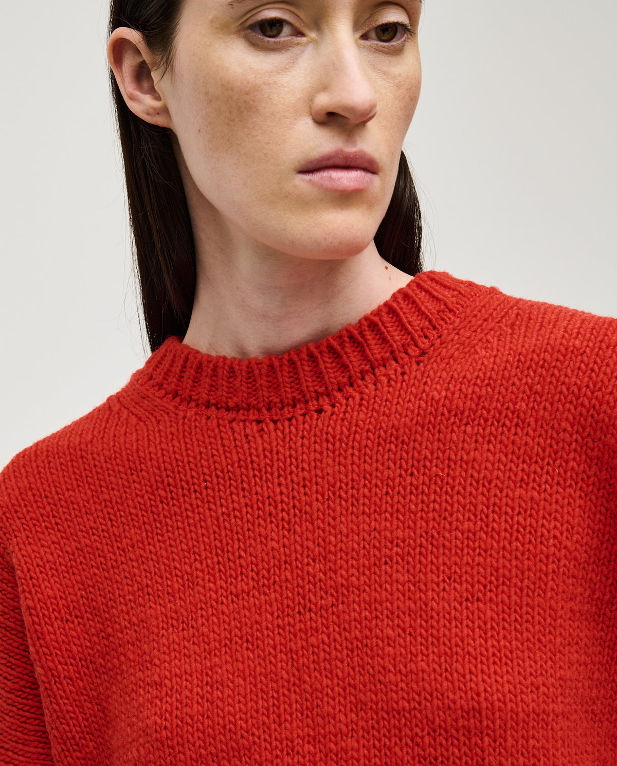 Red Babaà No61 women's jumper, soft knit fabric, close-up view showing fit and texture.