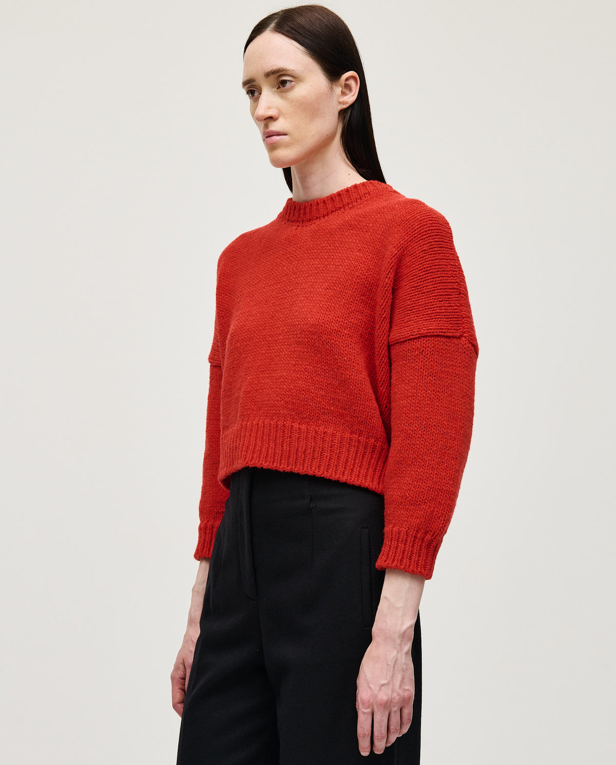 Red Babaà No61 women's jumper displayed on a model, featuring a cozy fit and stylish design.
