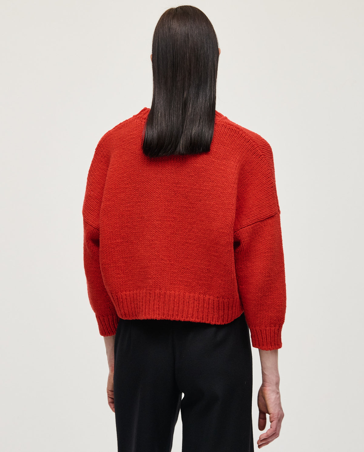 Red Babaà No61 women's jumper displayed on a model, featuring a cozy fit and stylish design.