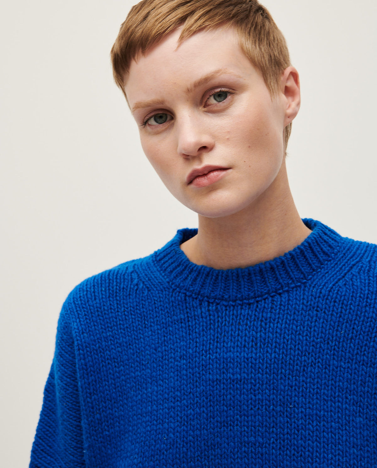 Babaà No61 Winterskies women's jumper, cozy knit sweater in a winter-inspired pattern, worn by a woman outdoors.