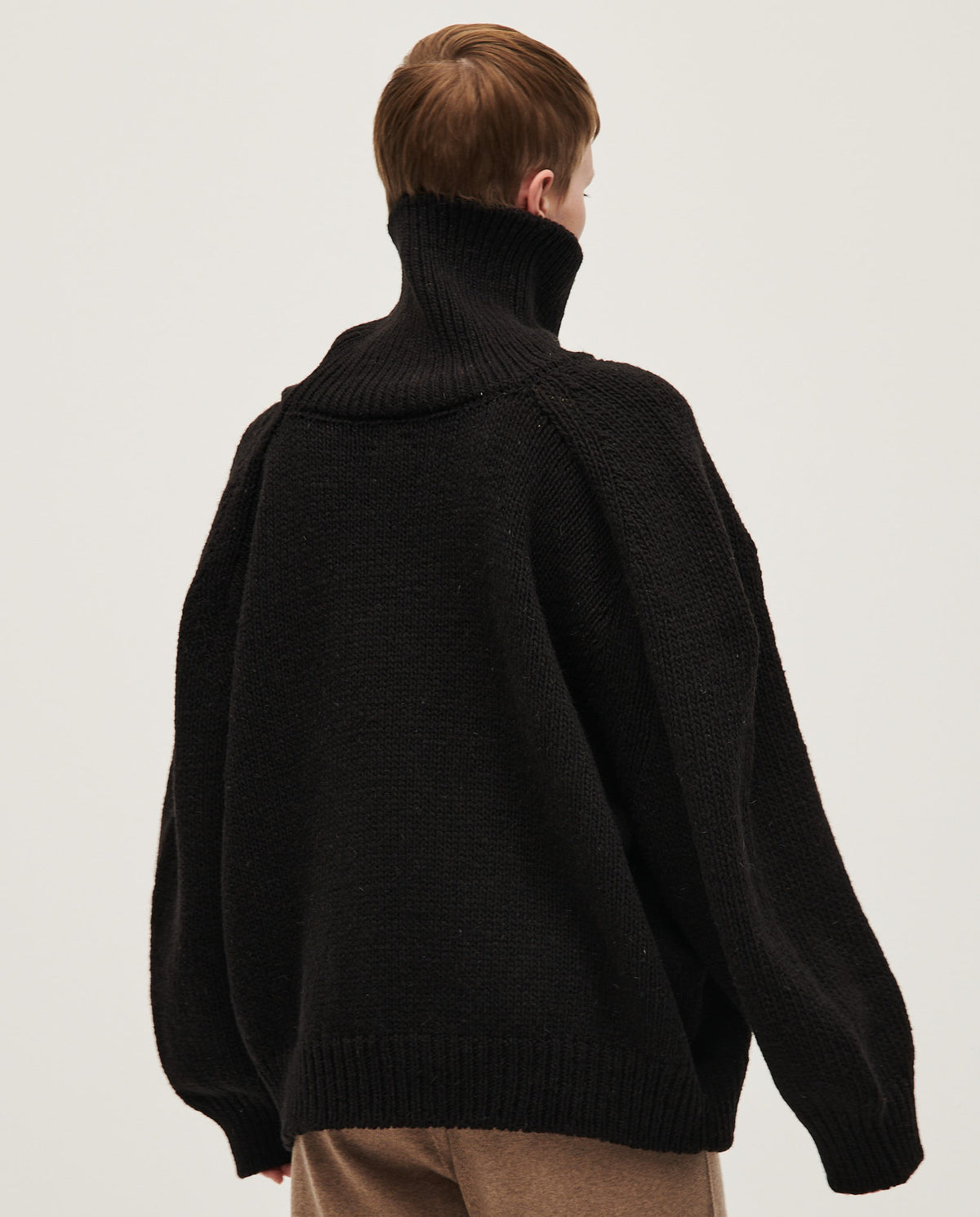 Black Babaà No67 women's jumper shown on a model, featuring a cozy, stylish knit design ideal for casual wear.