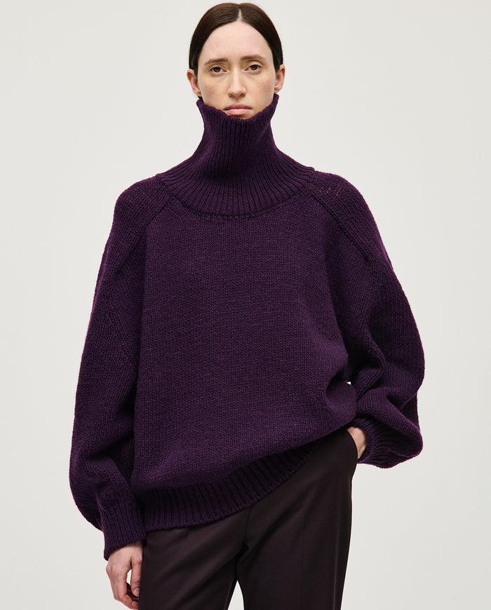 Purple Babaà No67 jumper worn by a woman, showcasing a cozy, fashionable knit sweater with a relaxed fit.