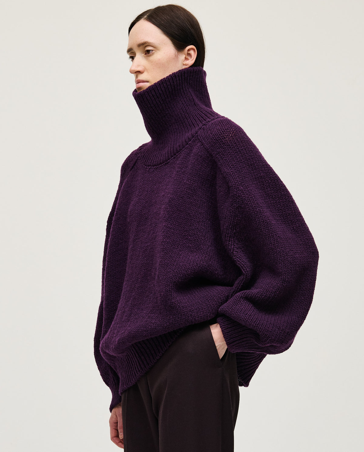 Purple Babaà No67 jumper worn by a woman, showcasing a cozy, stylish knit sweater with a relaxed fit.