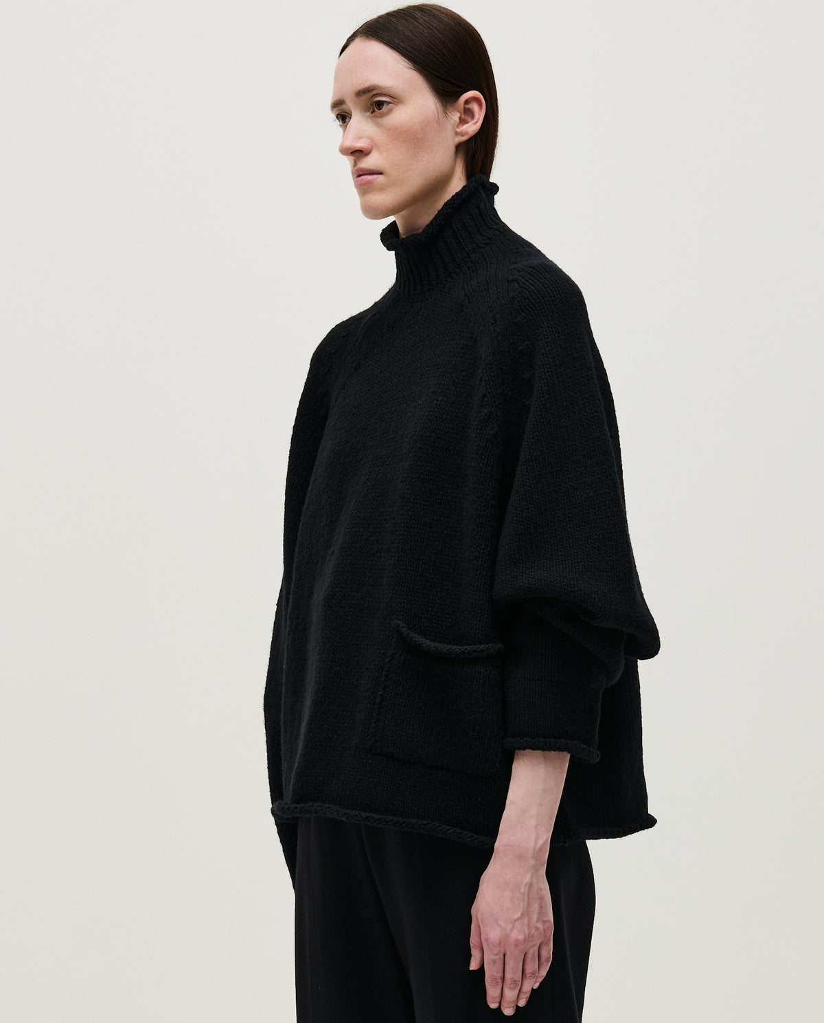 Black women's Jumper No70 by Babaà, featuring a cozy knit design and relaxed fit, shown on a model in this image.