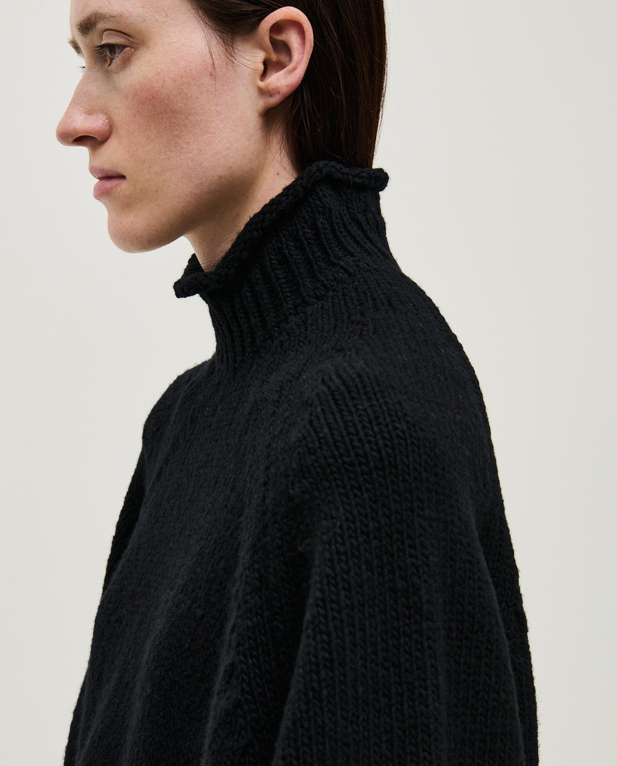 Black Babaà No70 women's jumper shown on a model, featuring a cozy, stylish knit design with long sleeves and a relaxed fit.