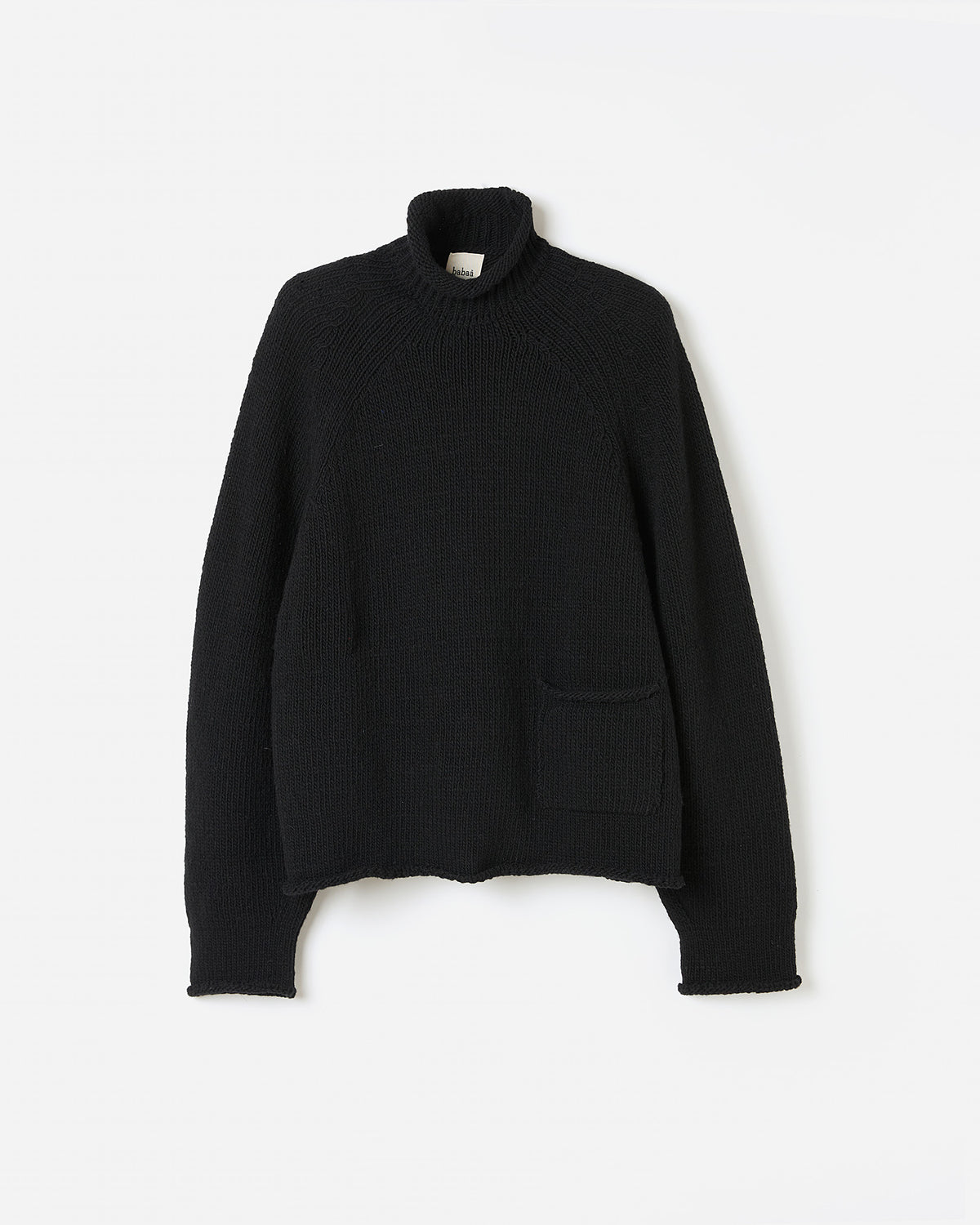 Black Babaà No70 jumper worn by a woman, silhouette view showing stylish, comfortable knit sweater for women.