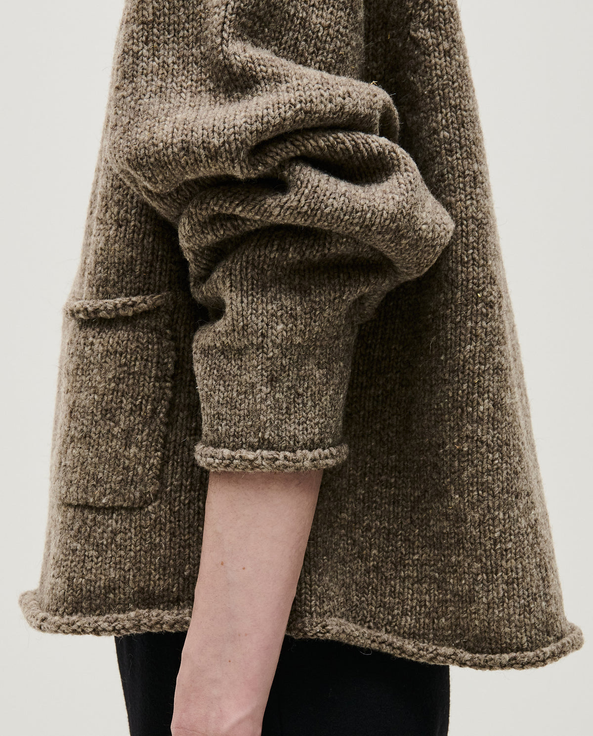 Woman wearing Babaà No70 Jumper in Dark Mist, showcasing the cozy knit sweater with a relaxed fit and soft texture.