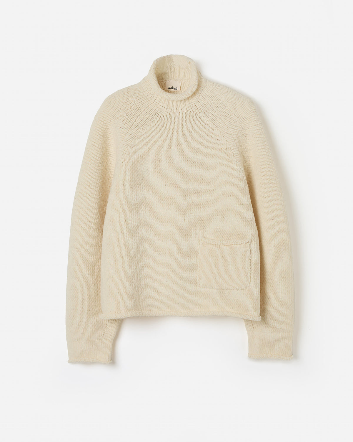 Woman wearing Babaà No70 Natural jumper, showcasing its relaxed fit and soft fabric in a casual silhouette.