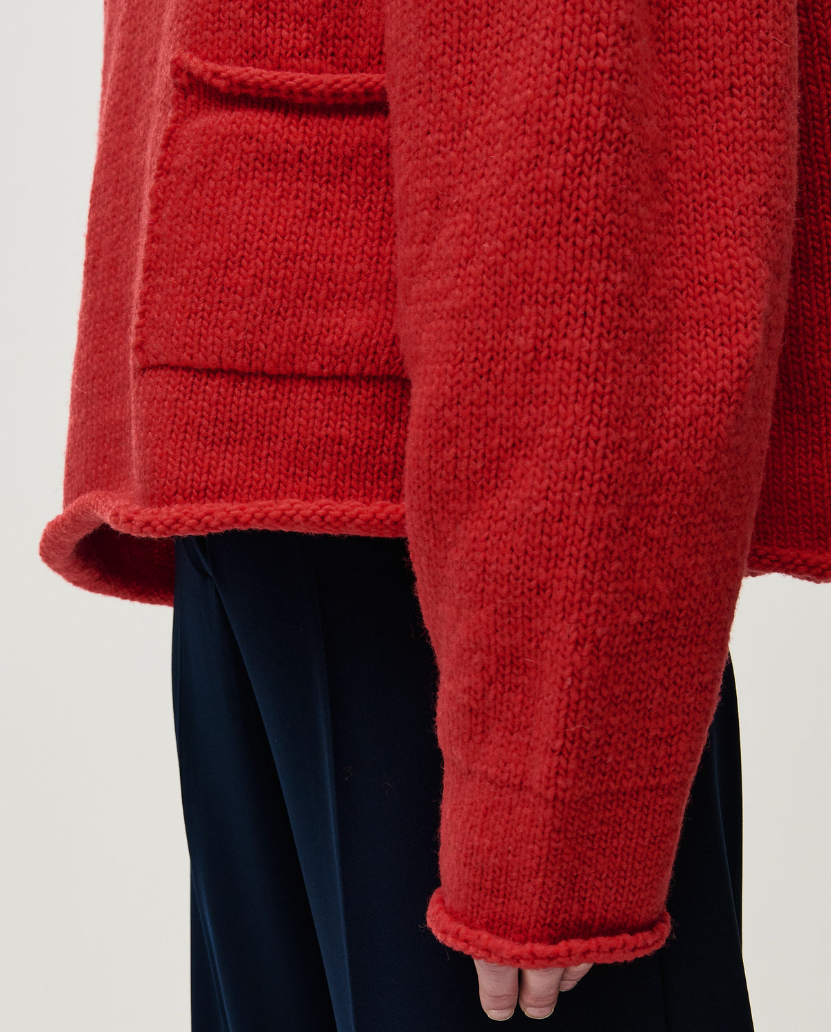 Red Babaà No70 women's jumper displayed on a model, featuring a cozy knit texture and stylish fit.