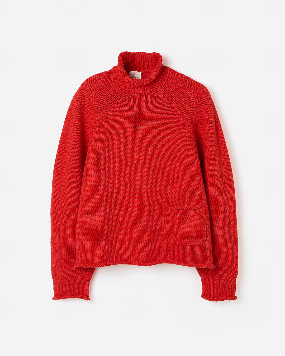 Silhouette of a woman wearing a red Babaà No70 jumper, showcasing its relaxed fit and stylish design.