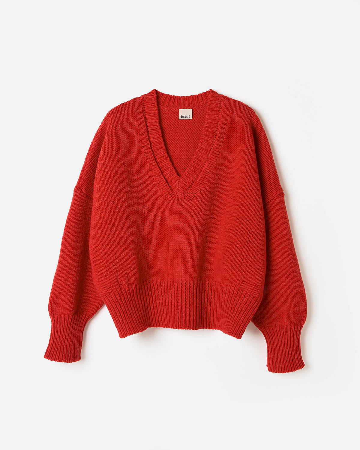 Red Babaà No75 women's jumper displayed in a silhouette pose, showcasing its stylish fit and vibrant color.