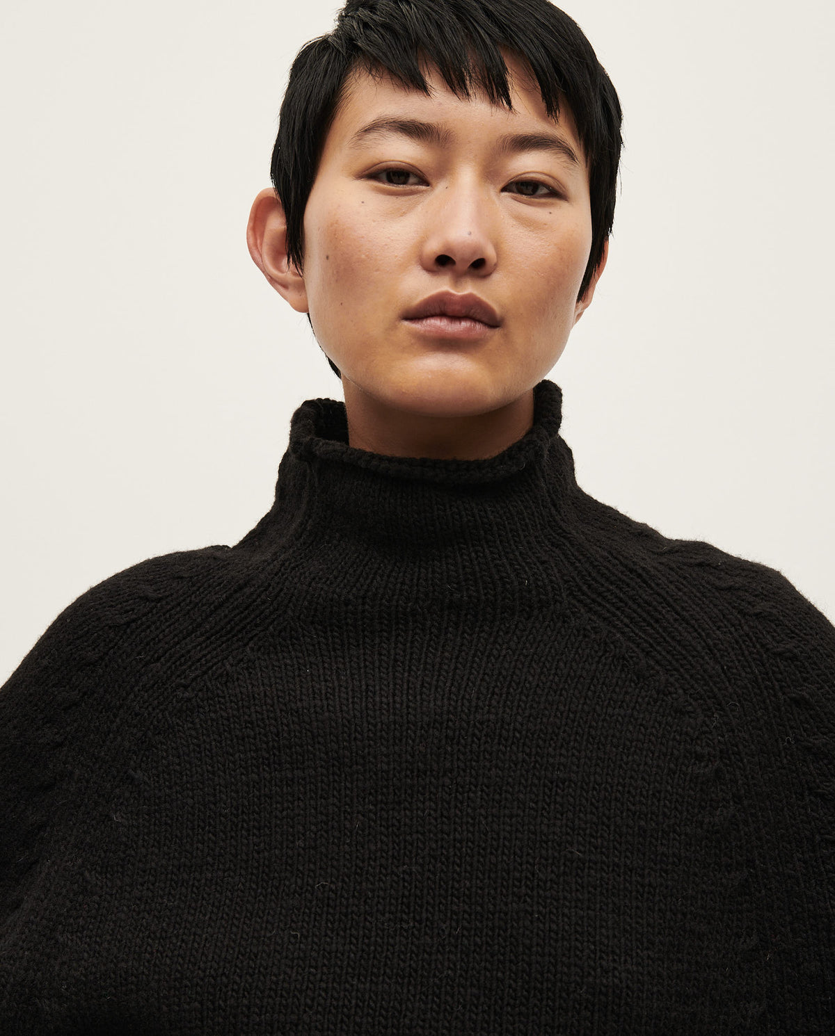 Black Babaà No81 women's jumper displayed on a model, showcasing a cozy, stylish knit sweater with a relaxed fit.