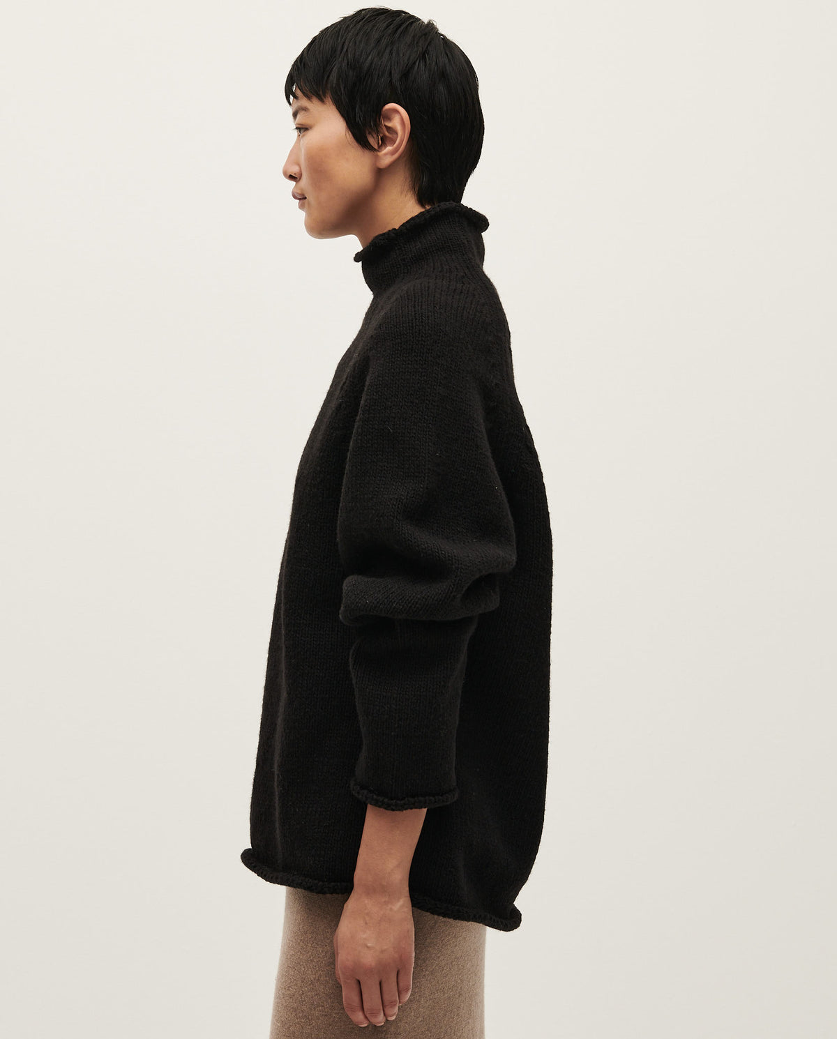 Black Babaà No81 women's jumper, soft knit fabric, fitted style, and long sleeves, shown on a model.