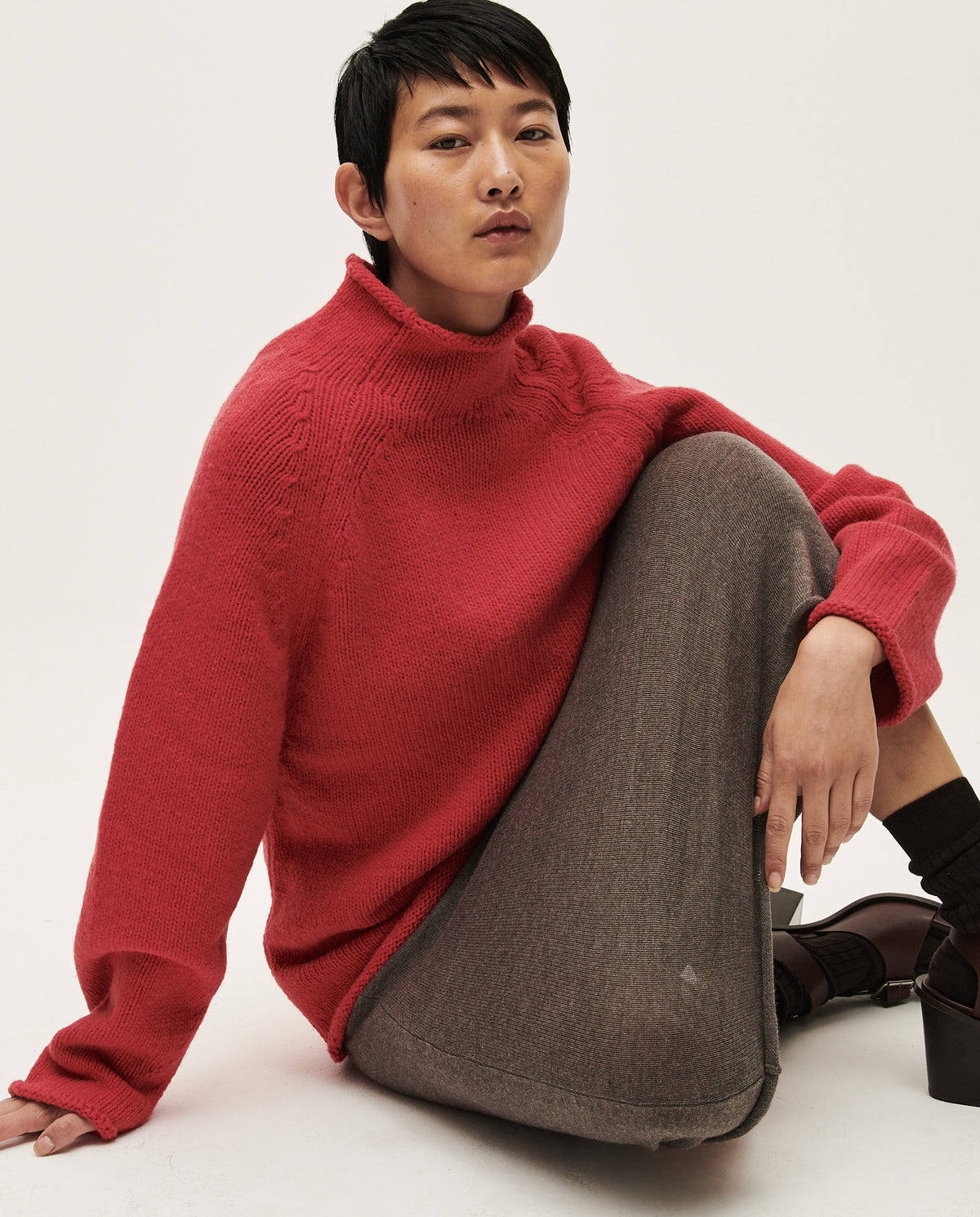 Babaà No81 Ruby women's jumper featuring long sleeves and a cozy knit fabric, shown in a rich ruby red color.