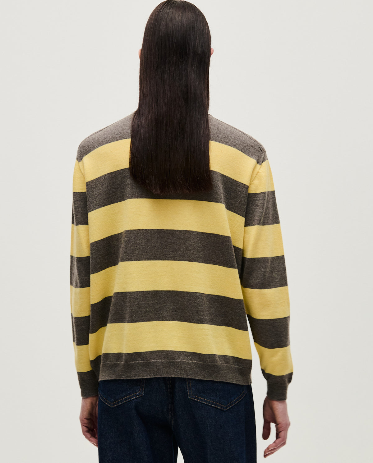 Woman wearing Babaà No84 Hay jumper, cozy knit sweater with a relaxed fit and neutral tones, suitable for casual wear.