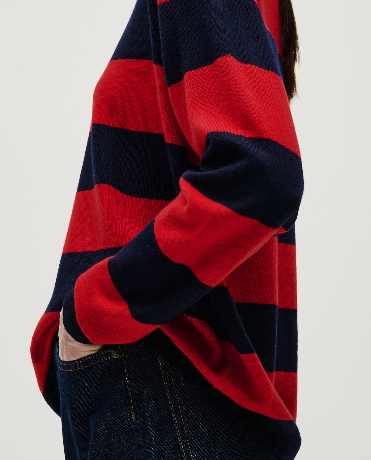 Woman wearing Babaà Jumper No84 Poppy, cozy knitted sweater with vibrant red poppy pattern and relaxed fit.