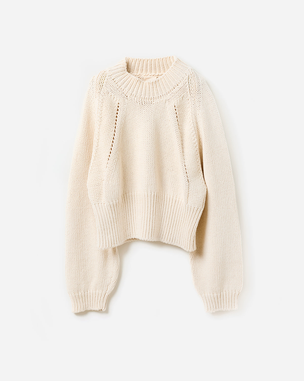 Woman wearing Babaà No86 natural jumper, showcasing its relaxed fit and soft fabric in a casual silhouette.