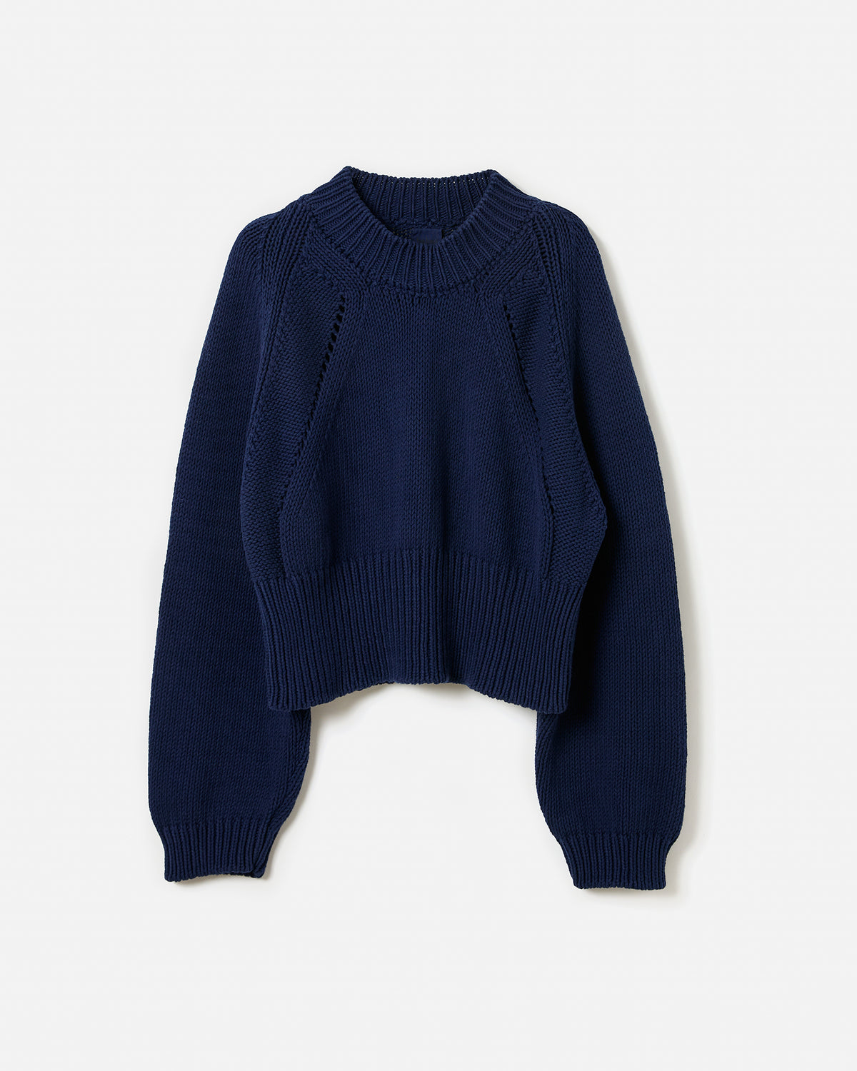 Navy Babaà jumper No86 worn by woman, showing silhouette of relaxed fit sweater with long sleeves and round neckline.