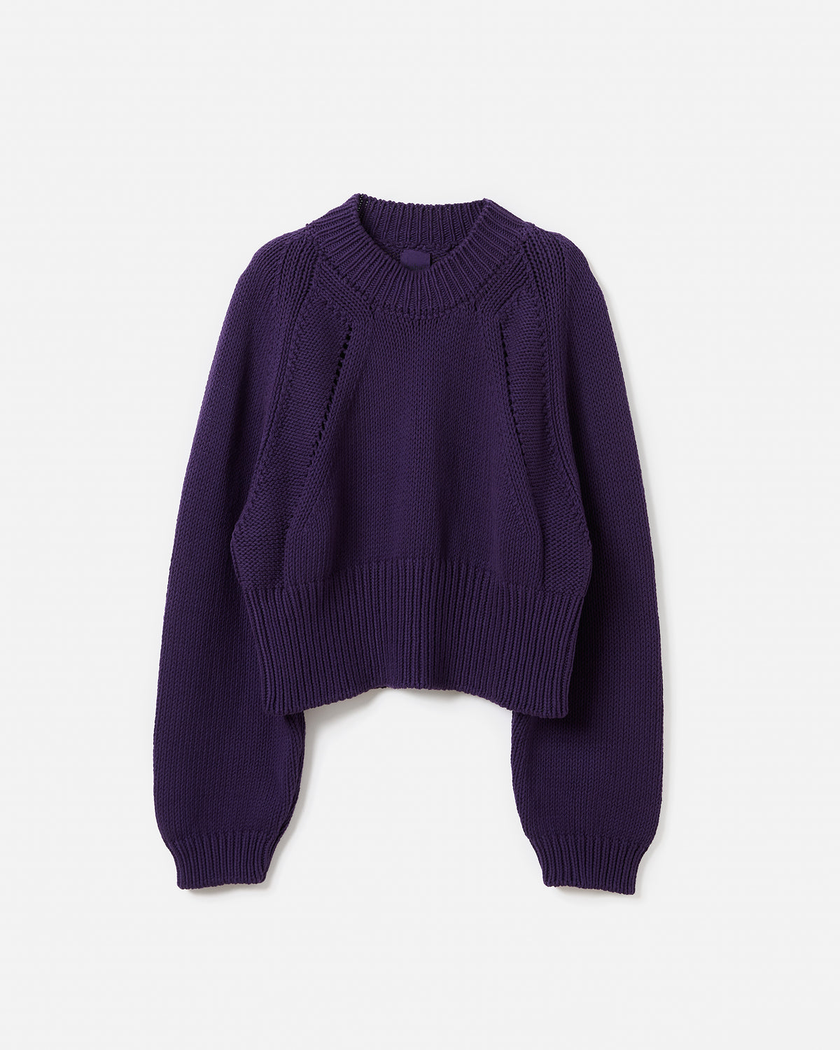 Woman wearing a Babaà No86 Ridge jumper in a silhouette view, showcasing its cozy knit design and relaxed fit.