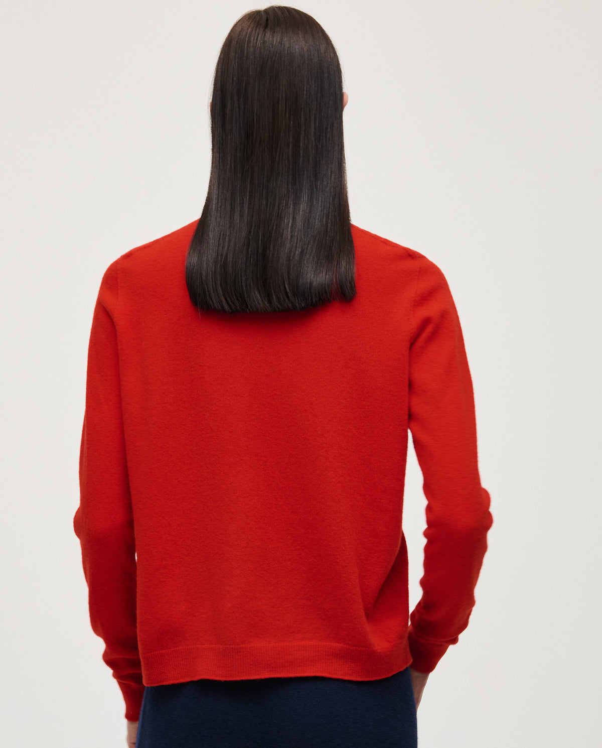 Woman wearing Babaà Jumper No89 Amapola, soft knit sweater with floral pattern, styled for casual comfort.