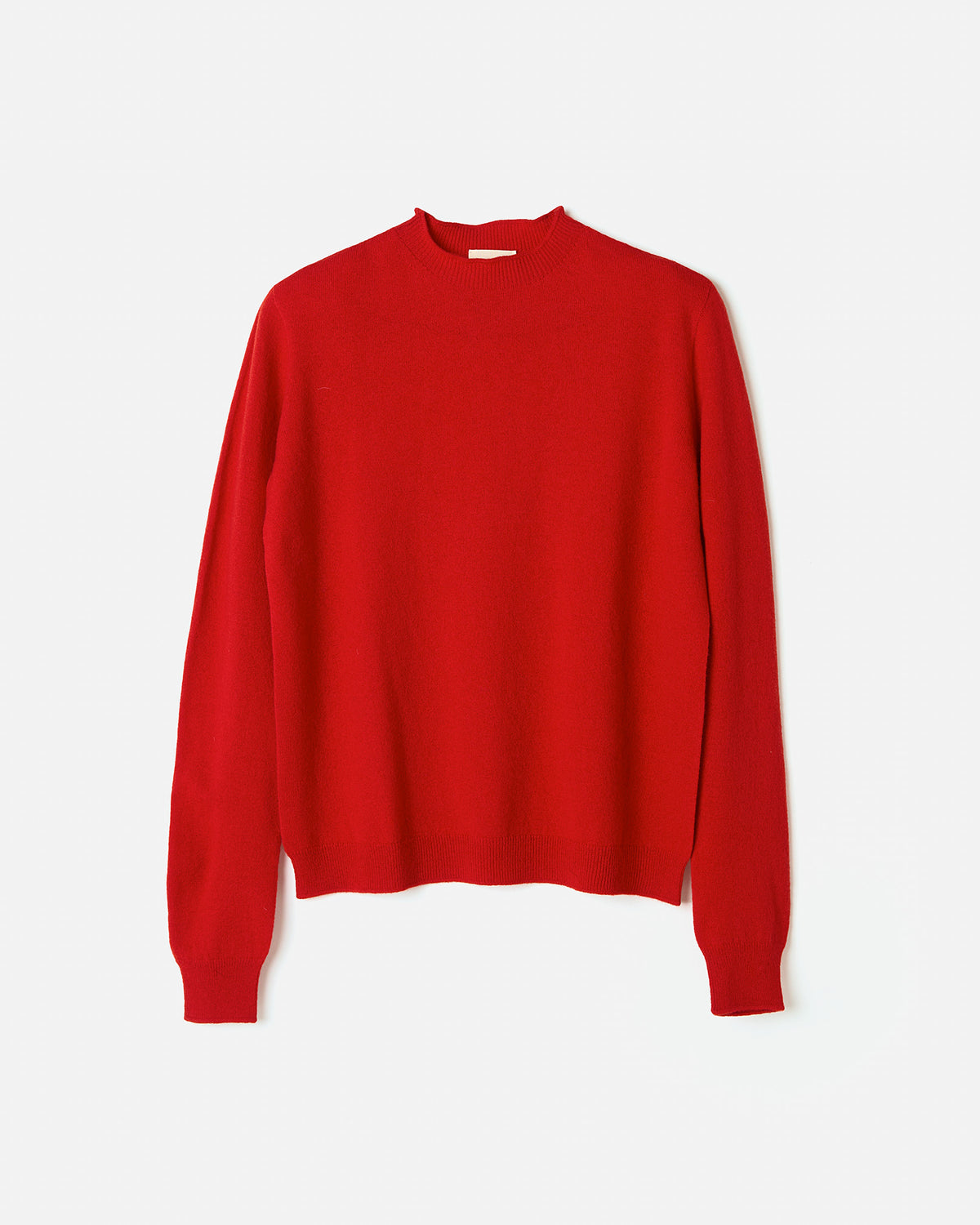 Woman wearing Babaà No89 Amapola jumper, stylish knit sweater with a relaxed fit, shown in a silhouette image.