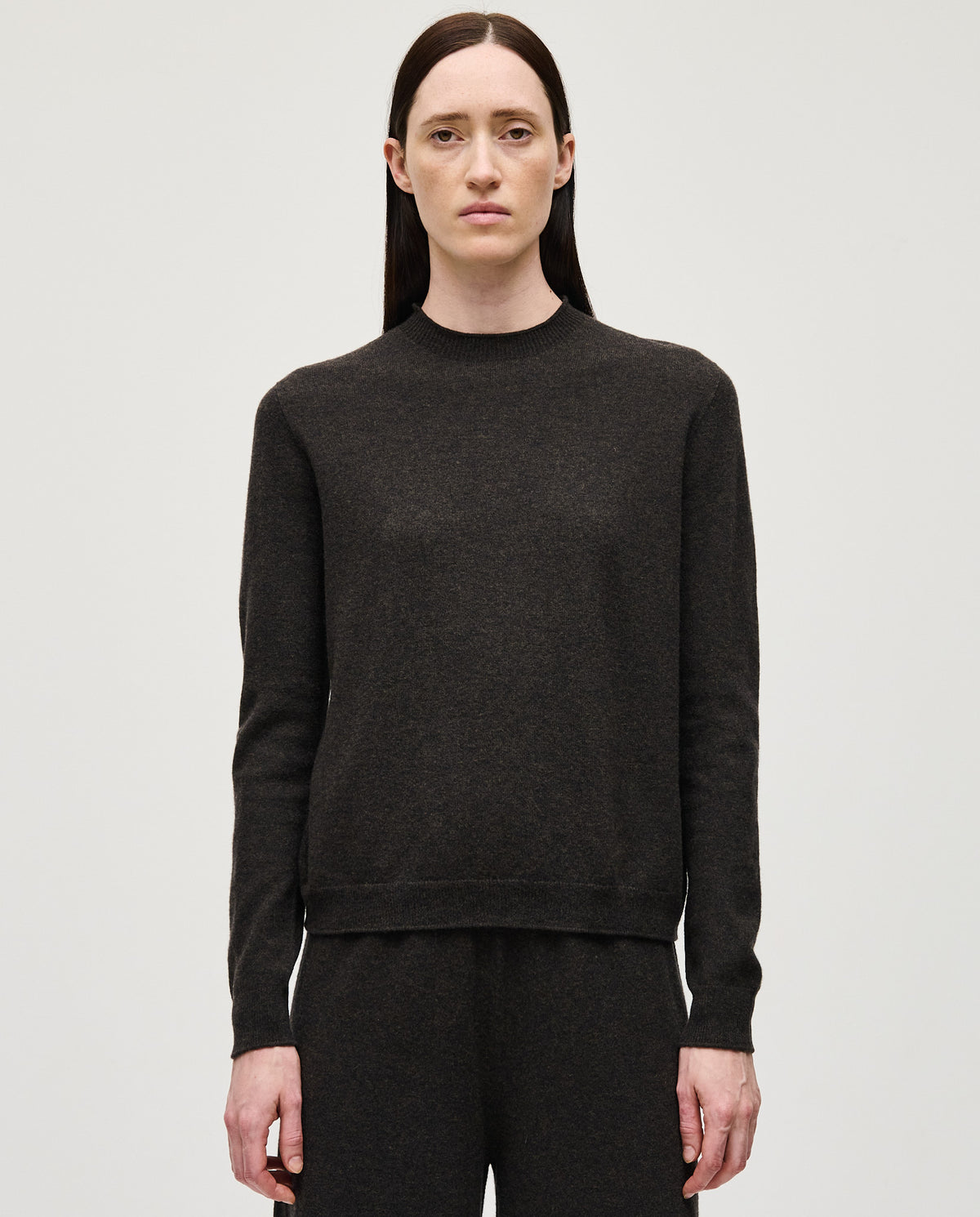 Woman wearing Babaà No89 Mica jumper, stylish knit sweater with a cozy fit, close-up of the textured fabric and design.