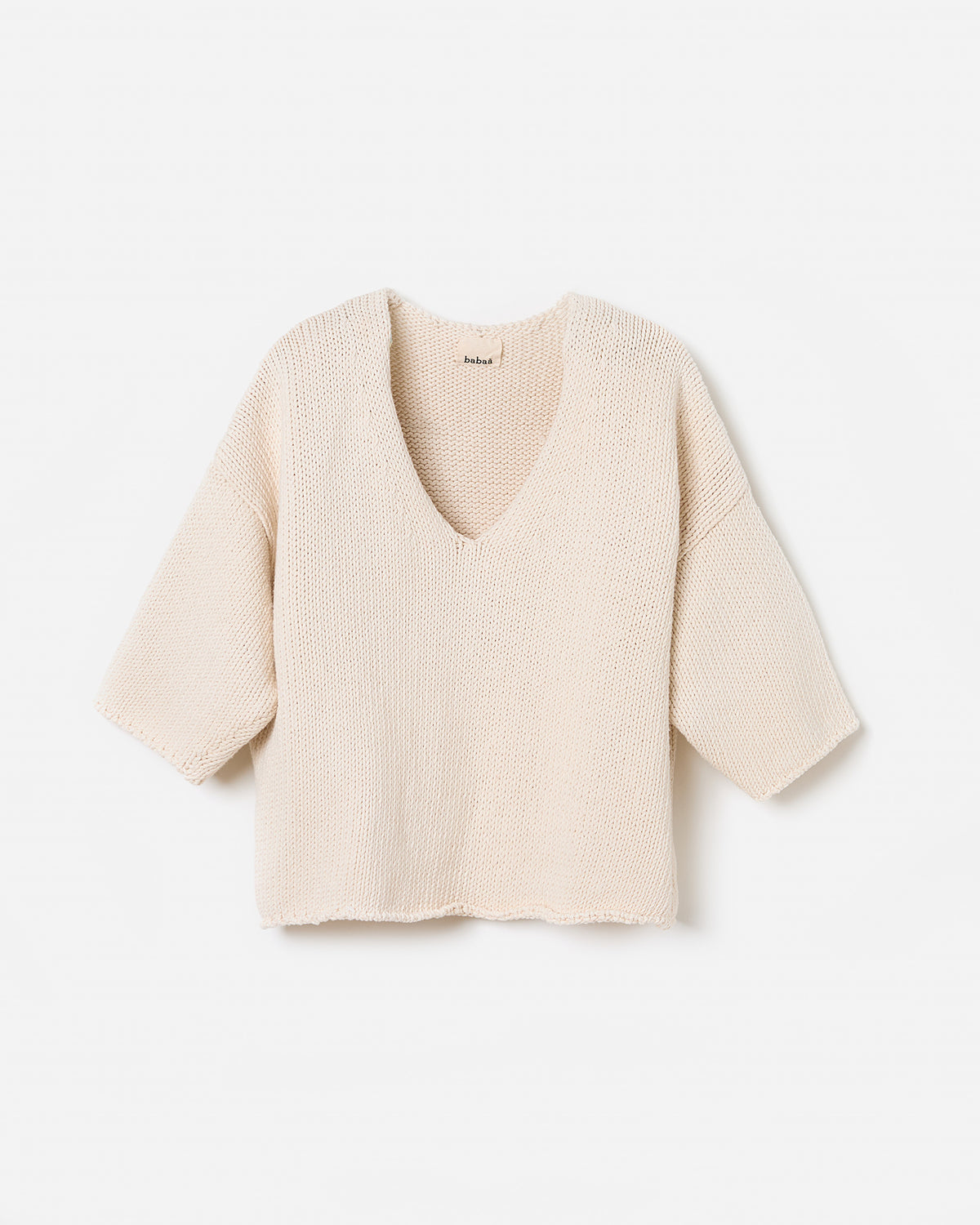 Woman wearing Babaà No9 Natural jumper, showcasing the relaxed fit and soft fabric in a casual silhouette.