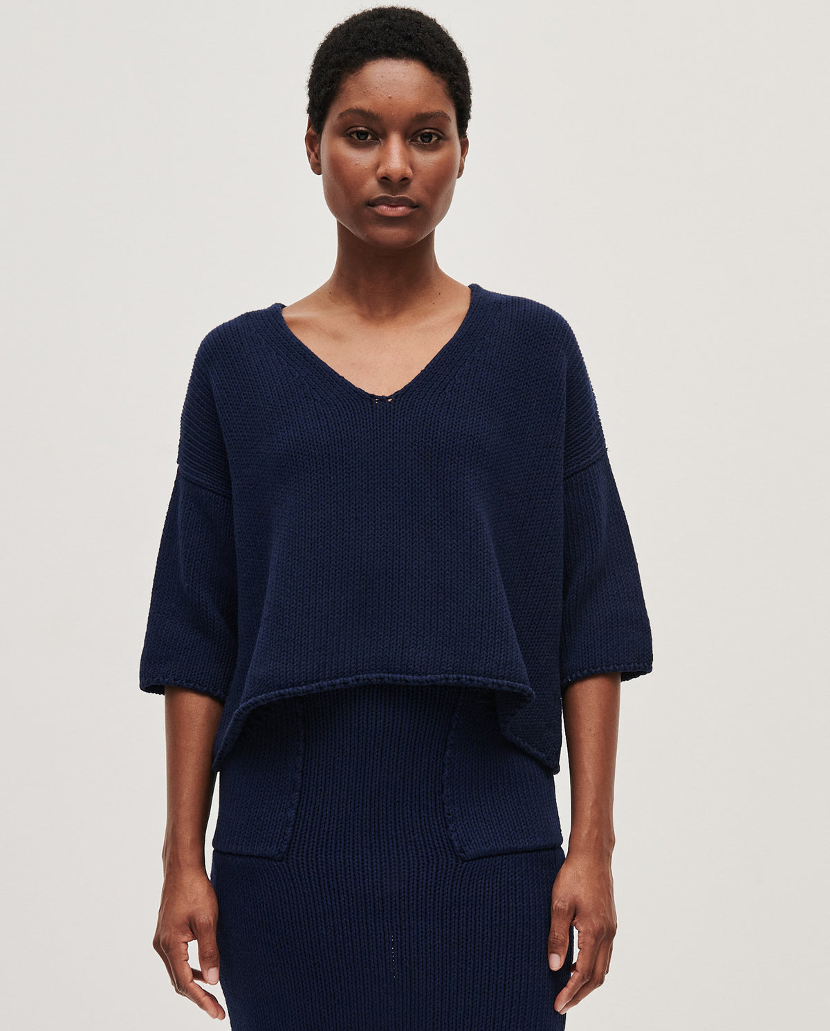 Navy Babaà No9 women's jumper shown in a close-up image, highlighting soft knit fabric and classic design.