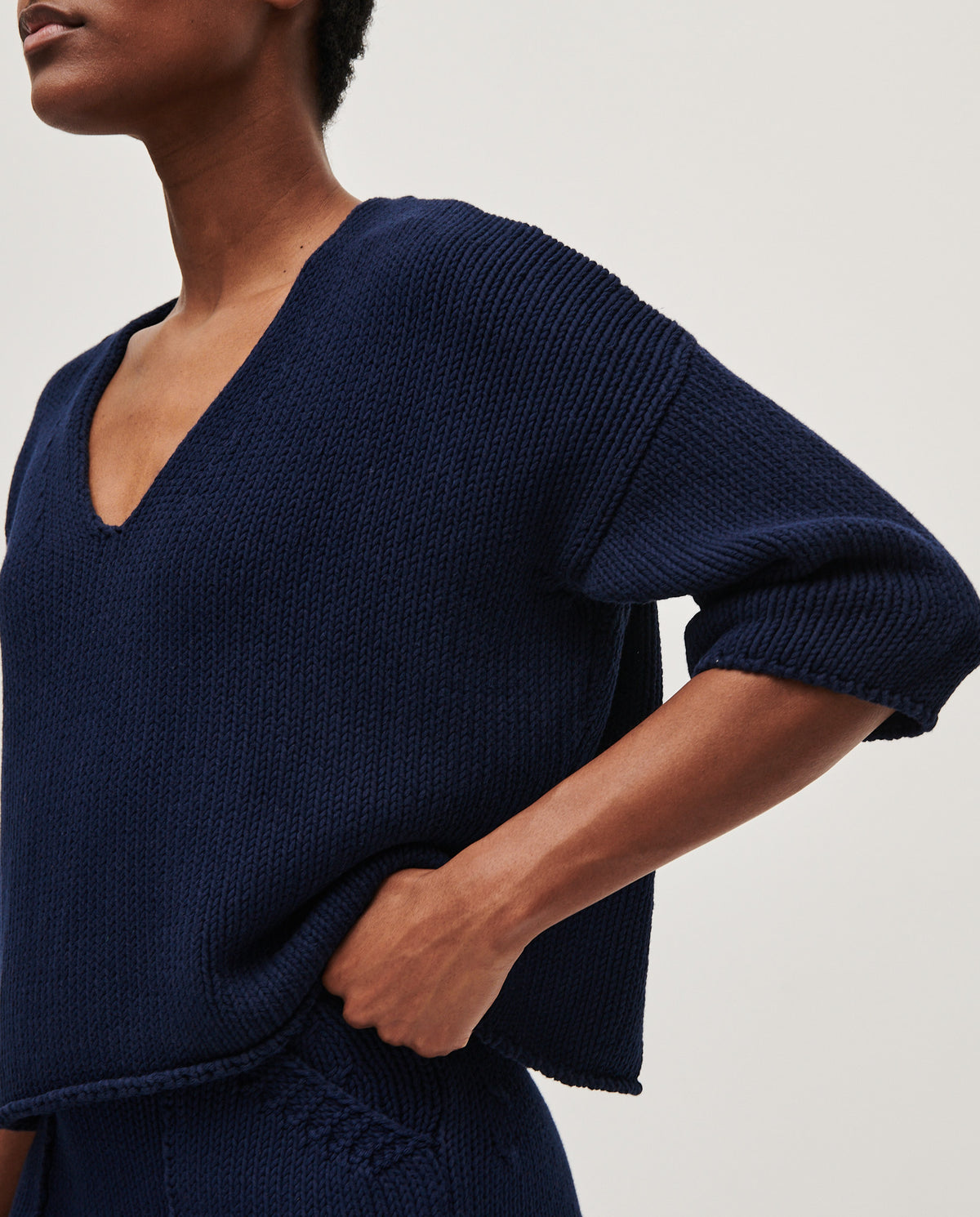 Navy Babaà No9 women's jumper displayed on a model, featuring a cozy fit and stylish design.
