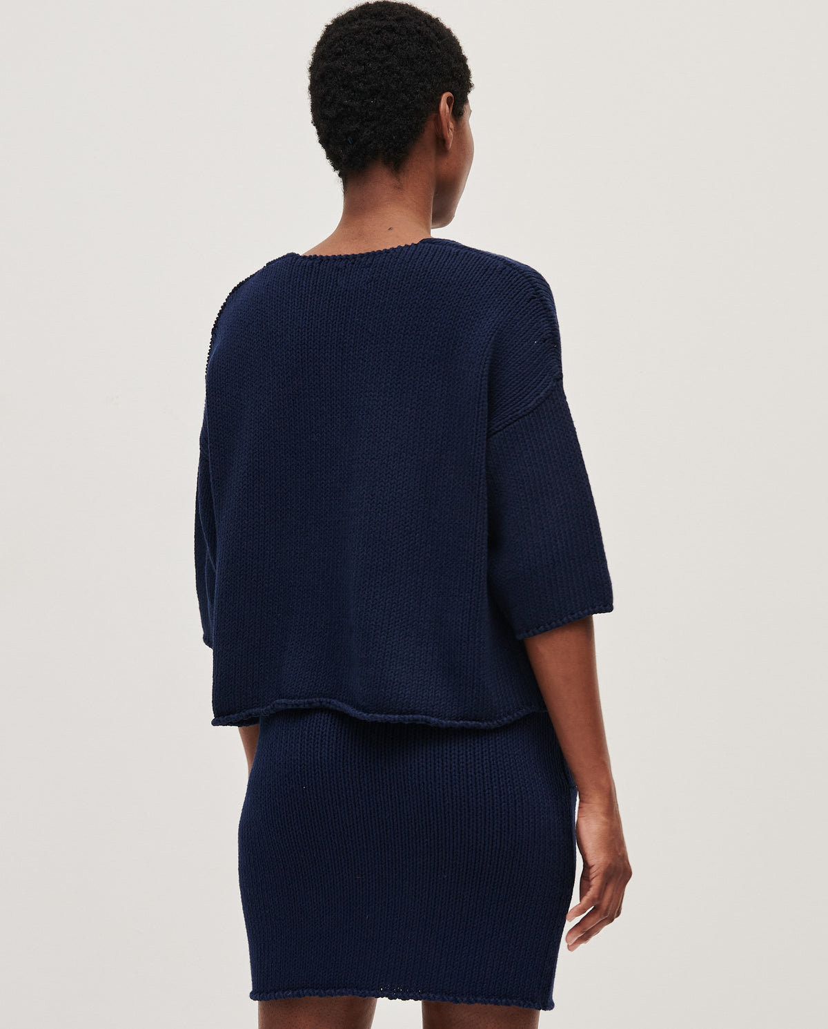 Navy jumper No9 by Babaà, worn by a woman, featuring a cozy fit and stylish design, perfect for casual wear.