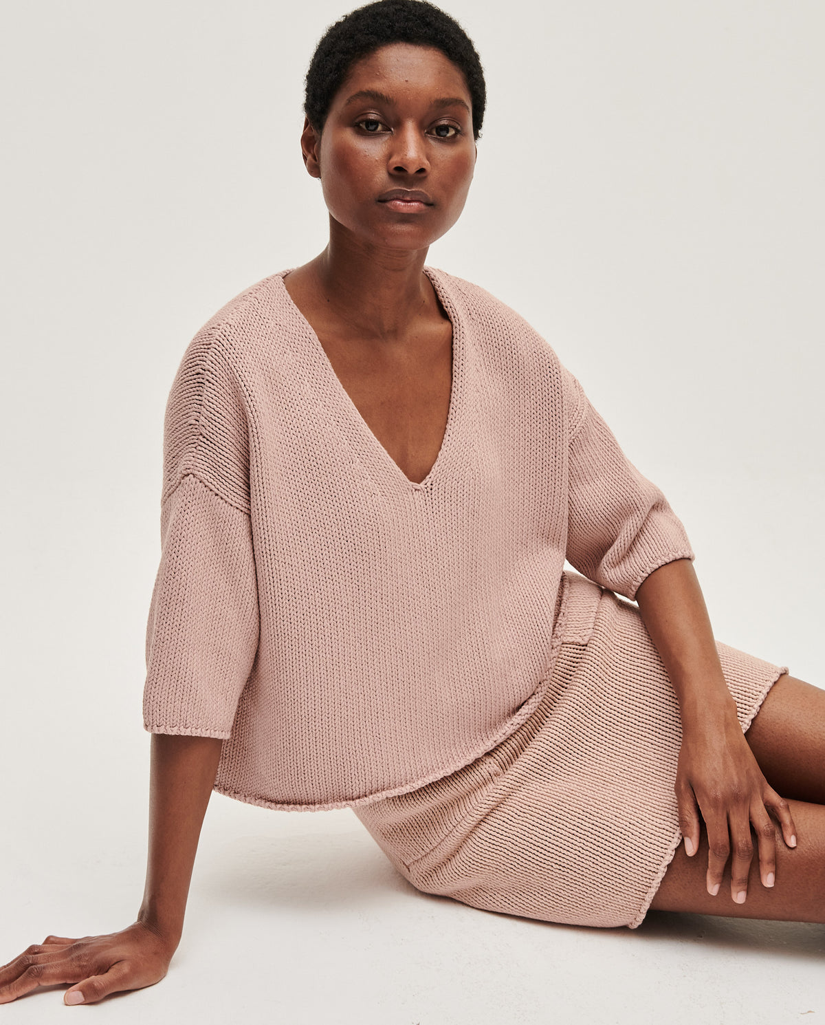 Babaà No9 plum blossom jumper worn by a woman, featuring a cozy knit design with a plum blossom pattern.