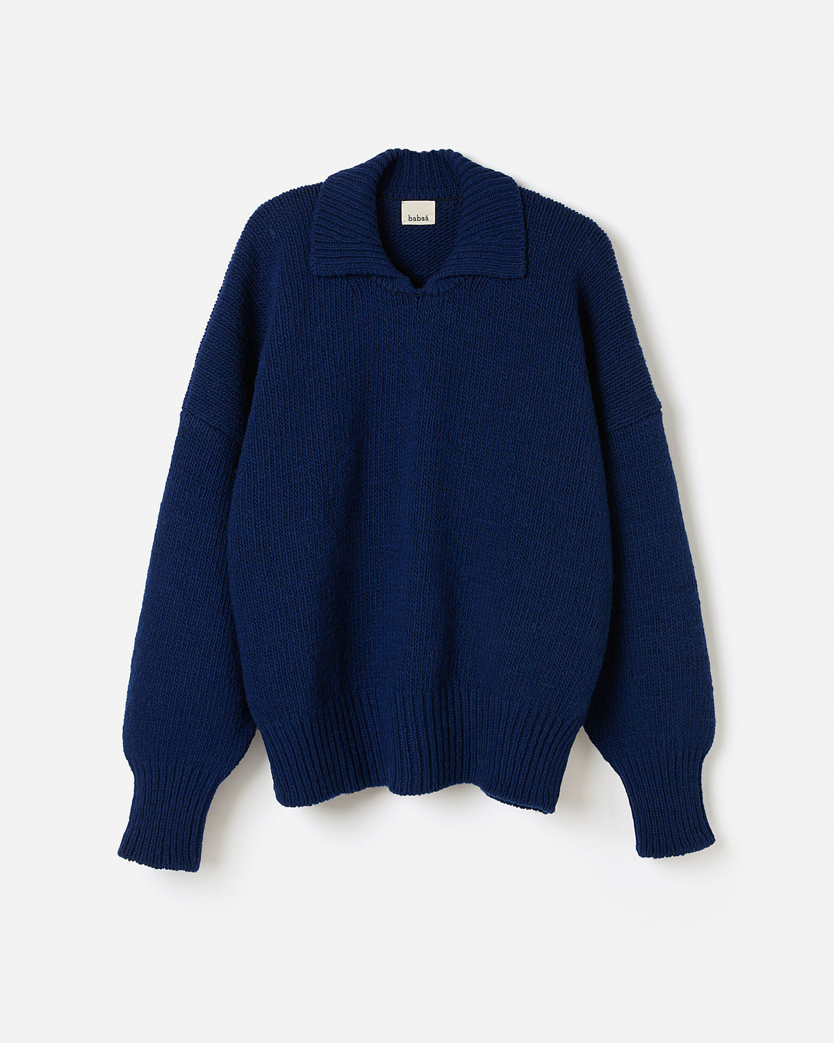 Navy Babaà No90 jumper worn by a woman, showcasing a relaxed fit and soft fabric in a stylish silhouette.