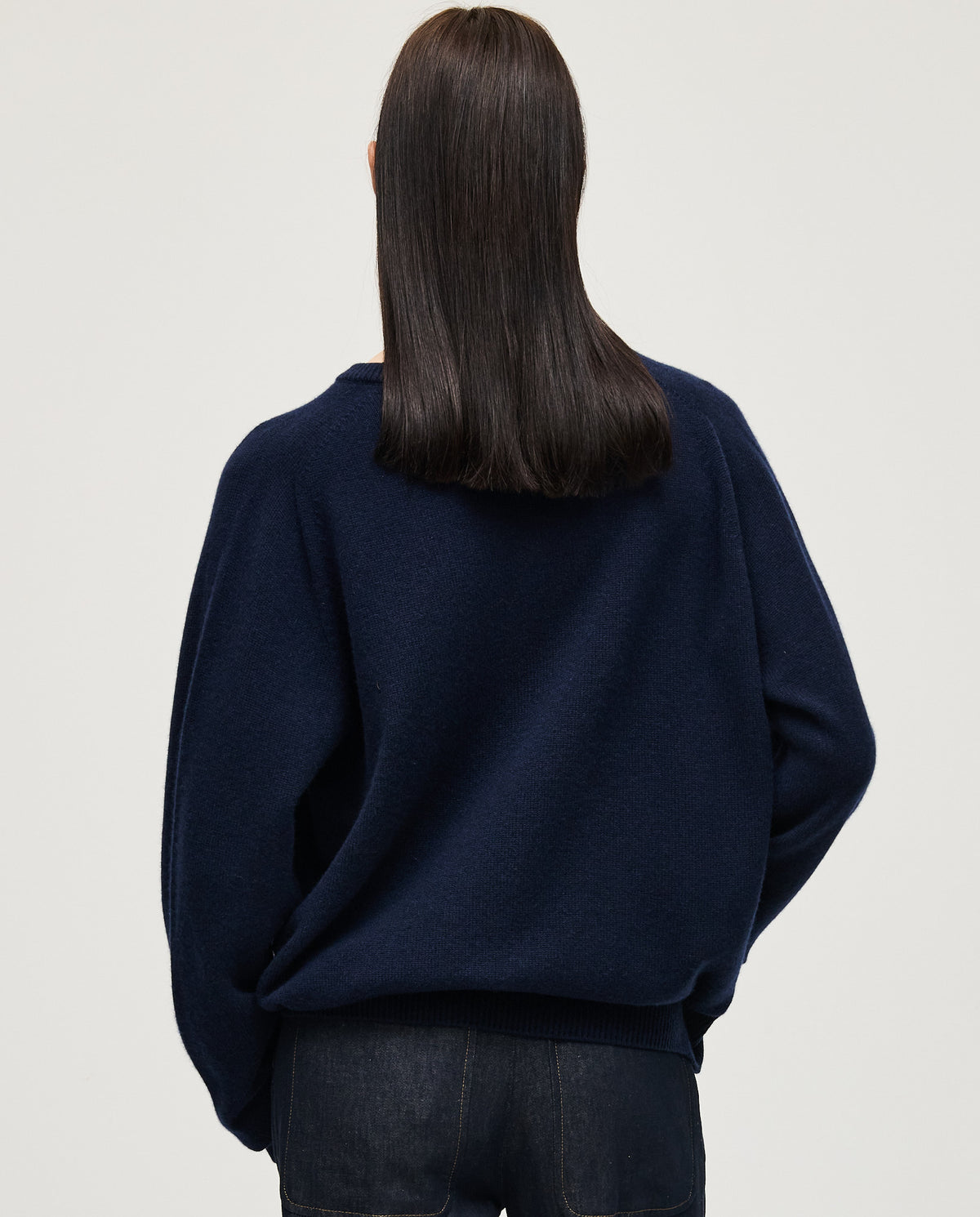 Navy jumper No91 by Babaà worn by a woman, featuring a relaxed fit and soft knit fabric, ideal for casual or cozy outfits.