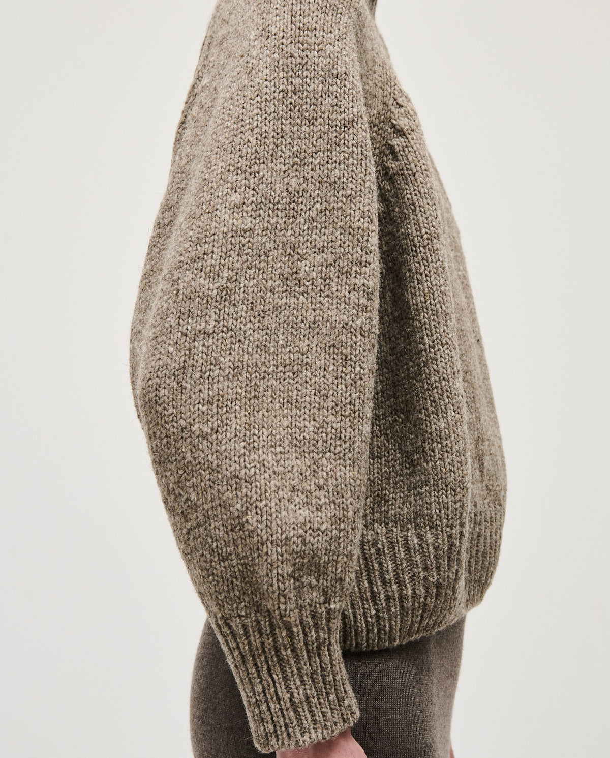 Babaà No95 dark mist jumper worn by a woman, featuring a cozy, stylish knit design in a soft dark mist color.
