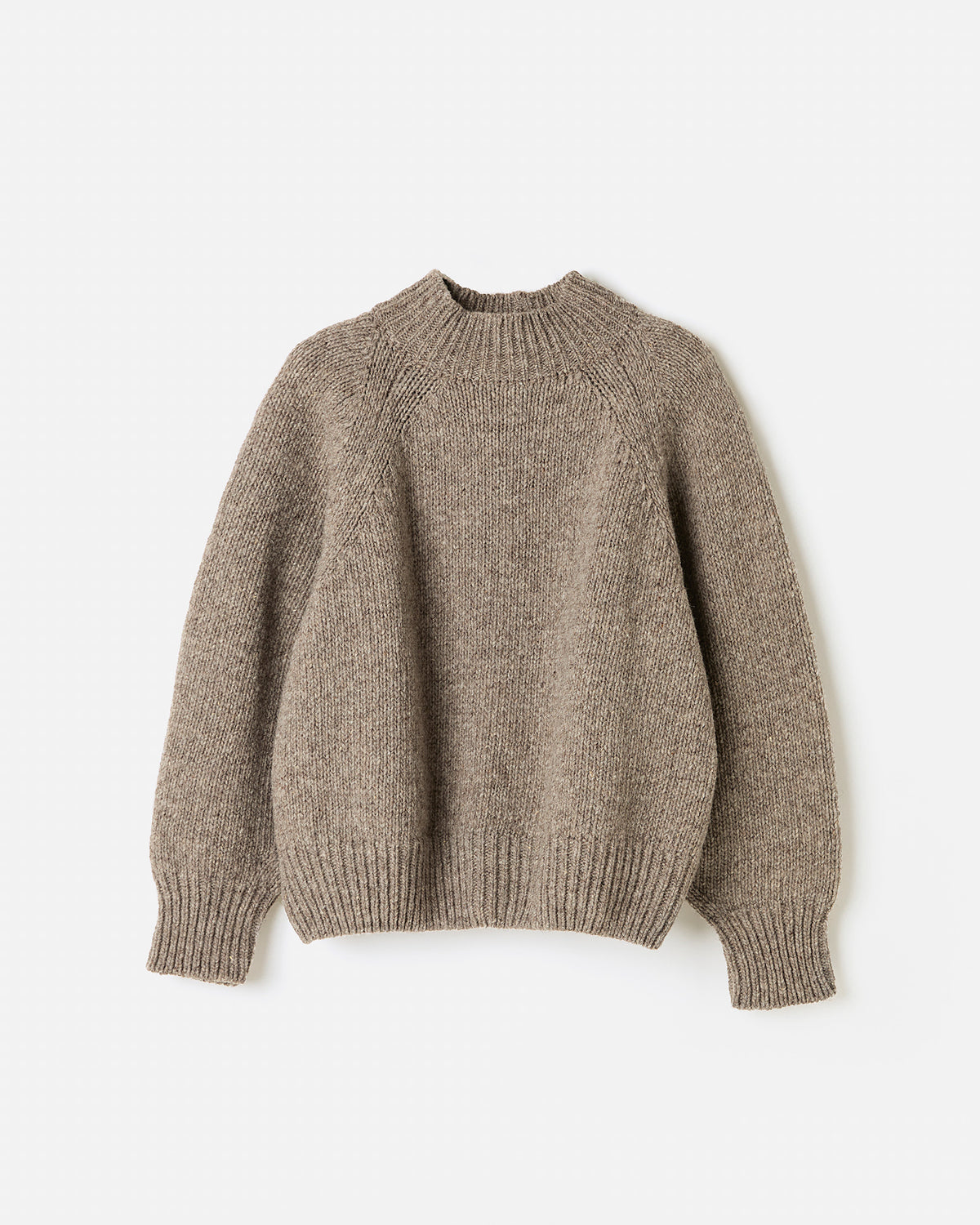 Silhouette of a woman wearing Babaà Jumper No95 in Dark Mist, showcasing the cozy, stylish knit sweater.