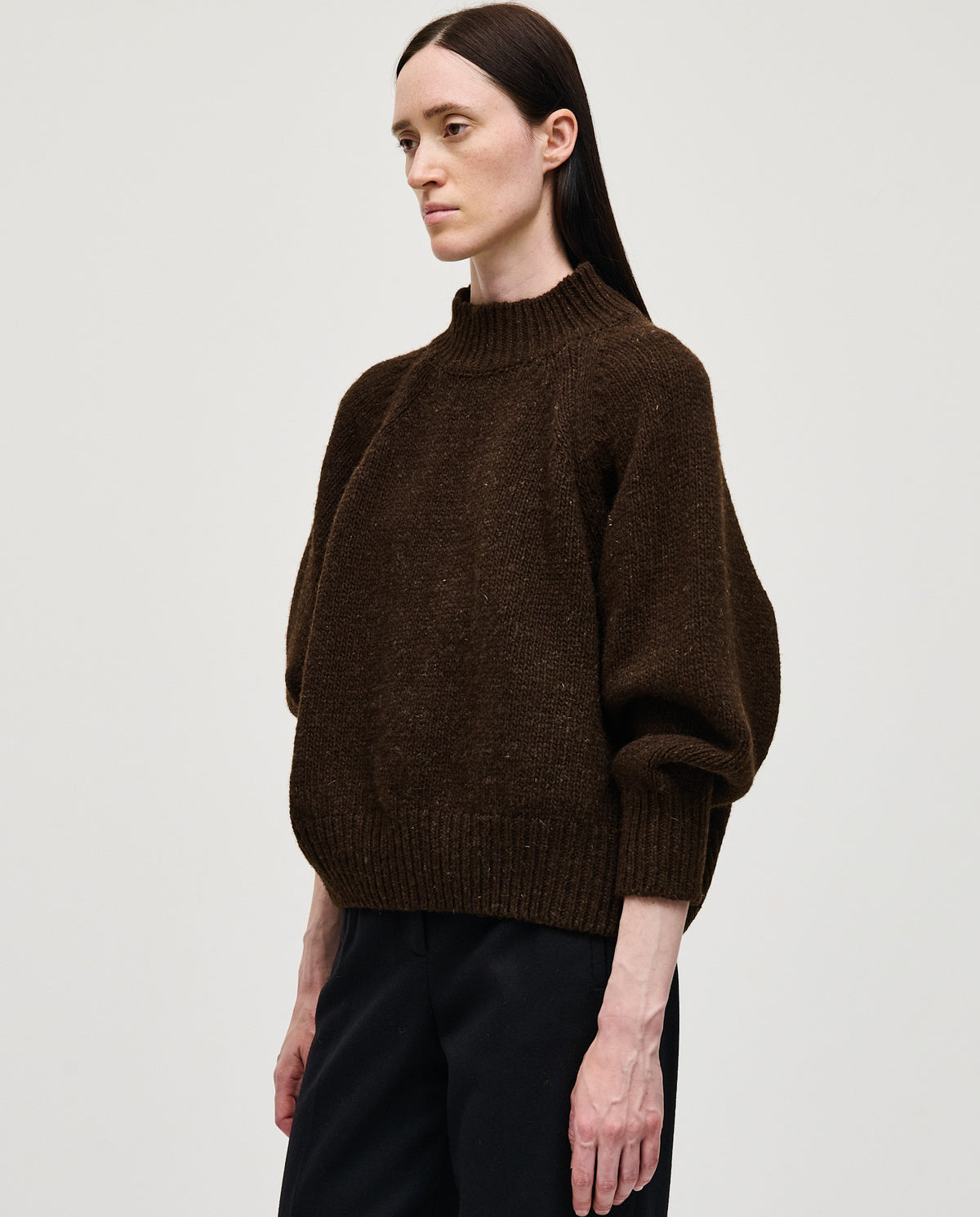 Babaà No95 Earth women's jumper in soft, earthy-toned knit fabric, featuring a relaxed fit and long sleeves.