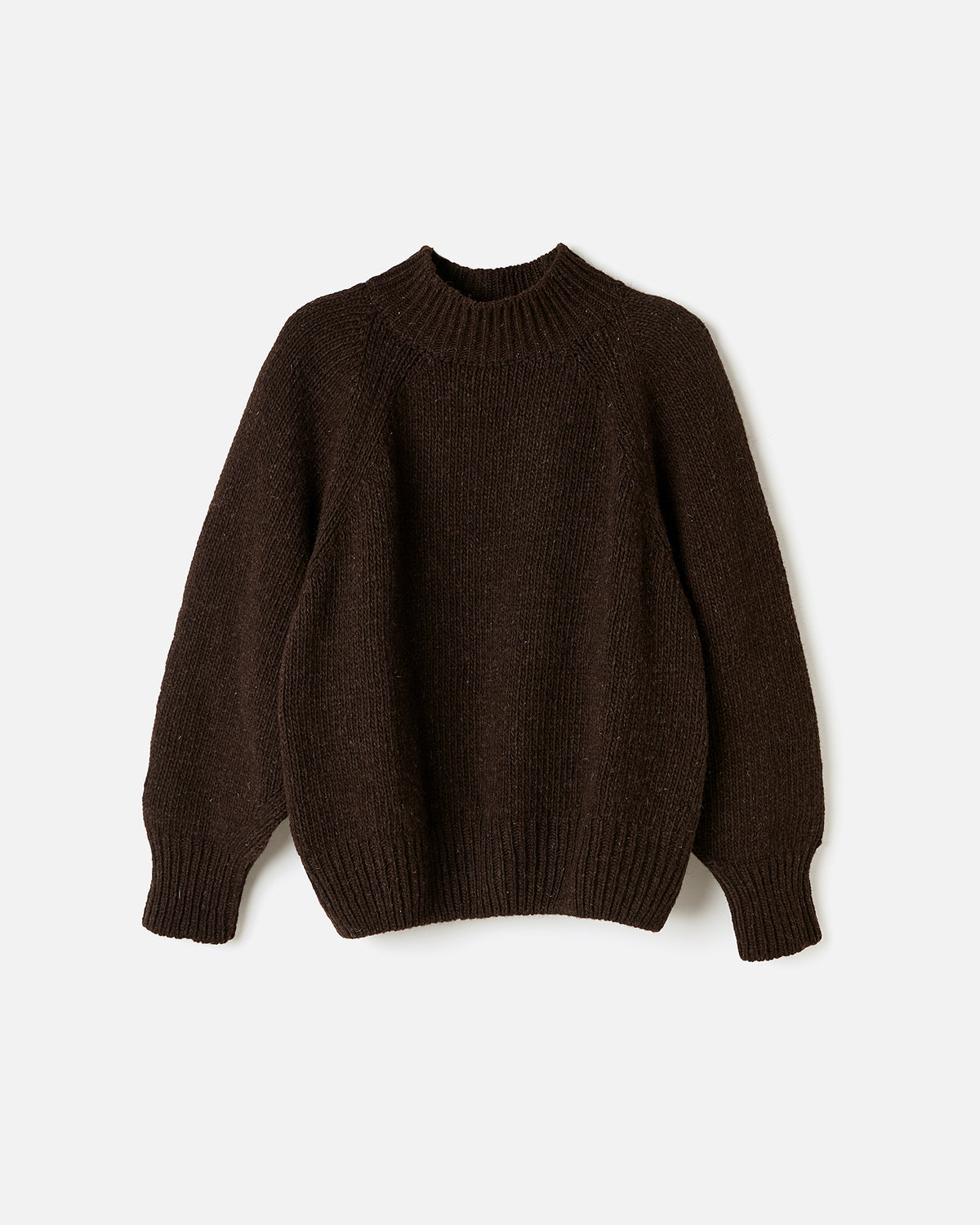 Silhouette of a woman wearing Babaà No95 Earth jumper, showcasing the relaxed fit and earthy tone of the knitwear.