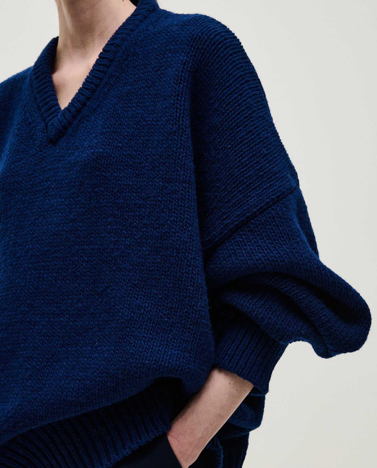 Navy jumper No97 by Babaà, stylish women's knit sweater with a cozy fit and ribbed cuffs, displayed on a model.