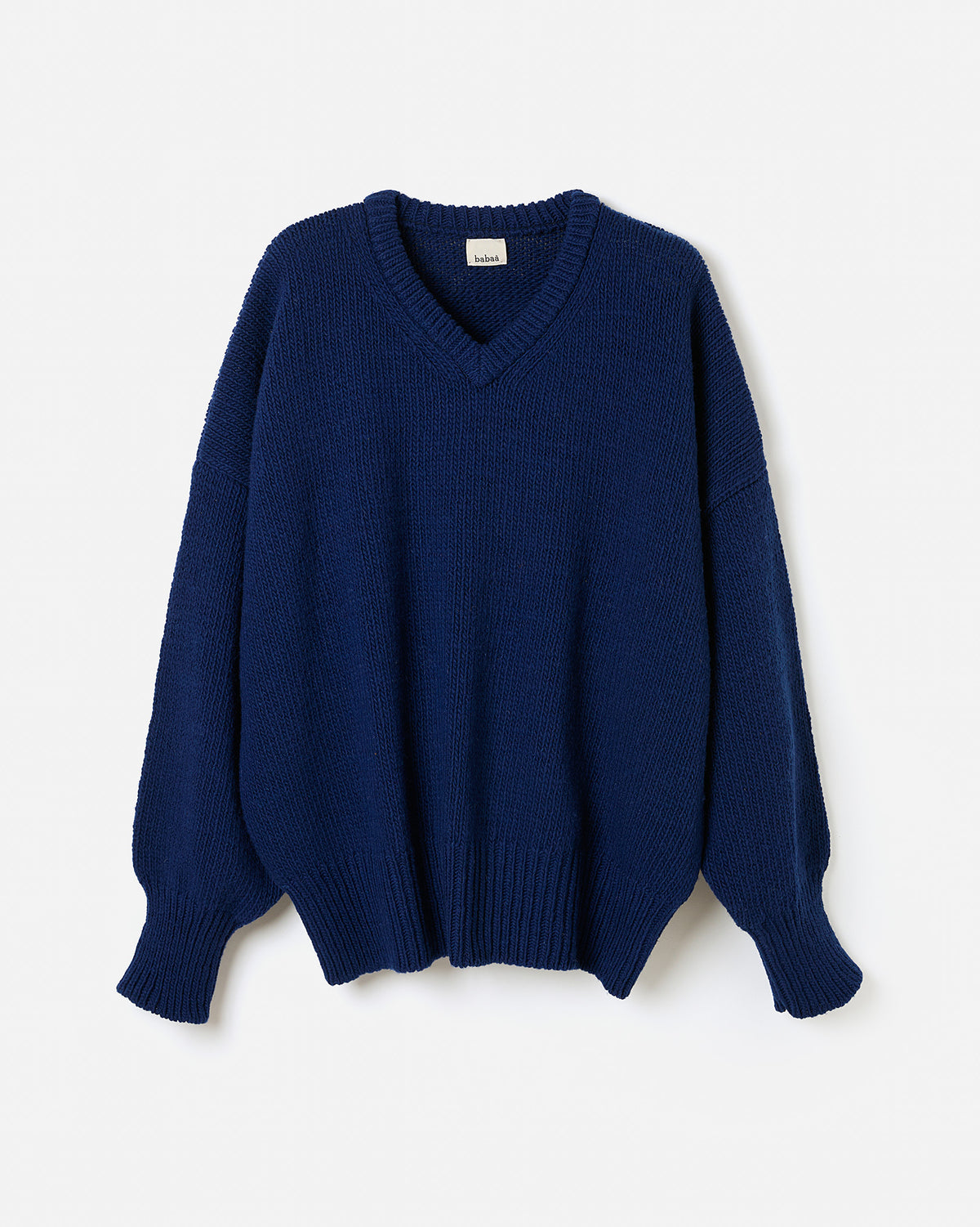 Navy jumper No97 by Babaà, worn by a woman, featuring a cozy fit and stylish silhouette.