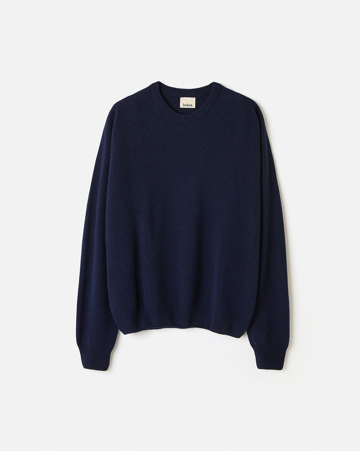 Navy jumper No99 by Babaà worn by a woman, showcasing a relaxed fit and soft fabric in a stylish silhouette.