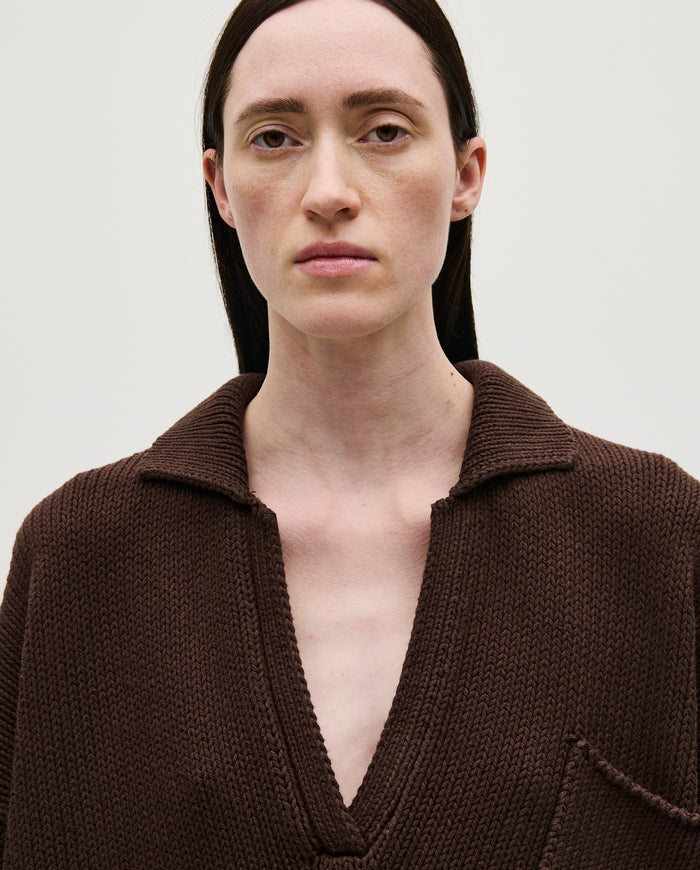 Woman wearing Babaà Polo No1 Husk in a casual style, showing the textured husk fabric and classic polo design.